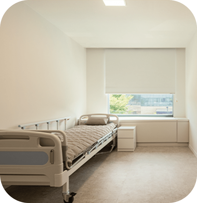 Hospital room with bed for 345 plastic surgery patients where natural results are achieved.