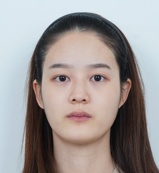 Person with headband staring at camera