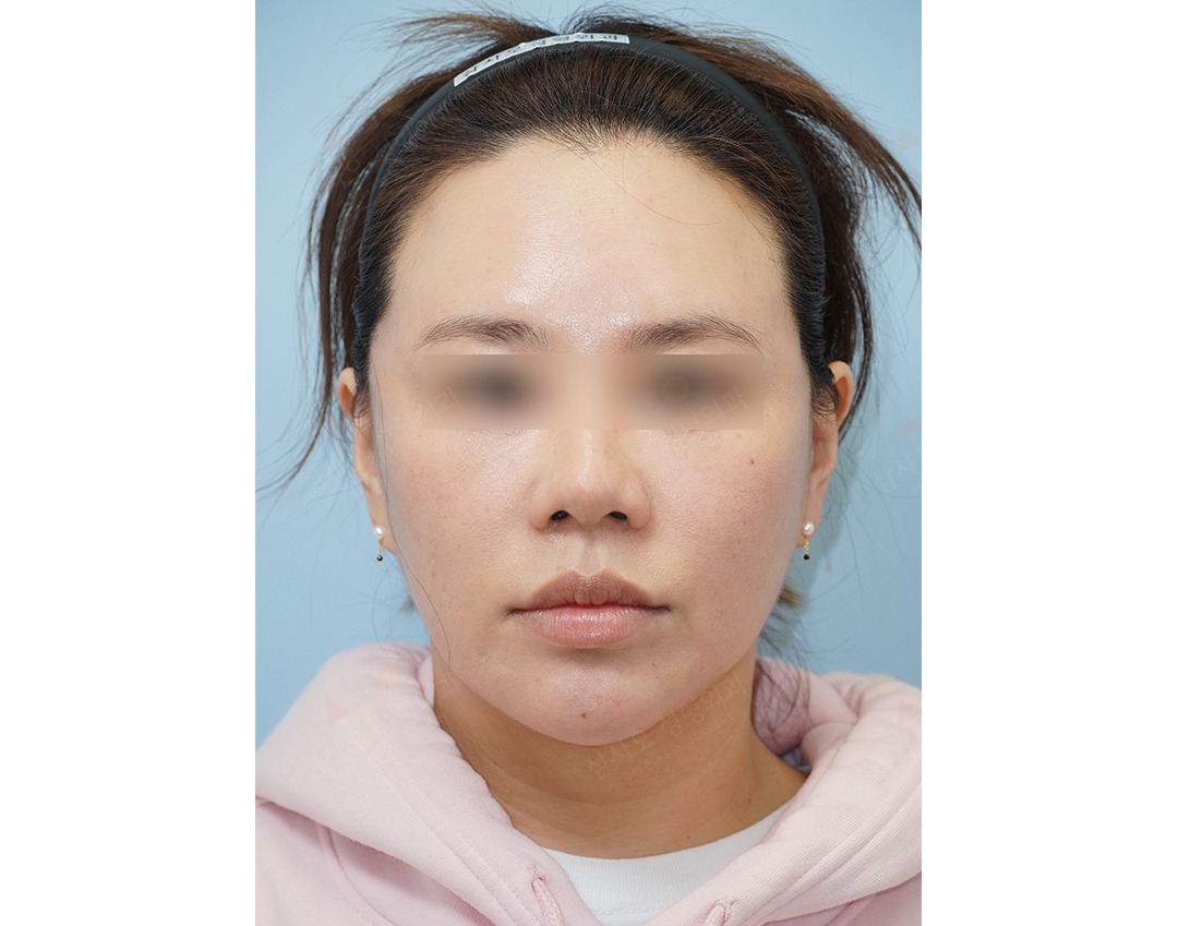 Person wearing a pink hoodie and headband.