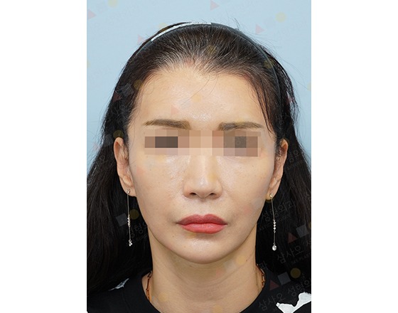 Woman with long hair and earrings